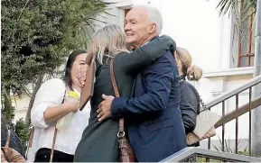  ?? CHRISTEL YARDLEY/STUFF ?? Bill Burr hugs a supporter after being found not guilty.