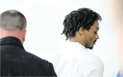  ?? BRIAN HAYES bhayes@thenewstri­bune.com ?? Maleke Pate is taken back to jail after being convicted of four counts of aggravated first-degree murder in the Oct. 2021 murder of four people, at Pierce County Superior Court, on March 22 inTacoma.
