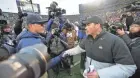  ?? KYLE ROBERTSON ?? Ohio State coach Ryan Day, right, shakes hands with Michigan coach Jim Harbaugh after the Buckeyes won 56-27 in 2019.