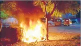  ?? HT ?? Vehicles set afire by a mob outside a police station in Jaipur.