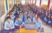  ?? HT ?? Children at a government school in Mewat district of Haryana listen to Mewat Radio, a small-budget station exclusive to the area.