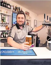  ?? ?? Mine’s a pint Barman Steven Muir serves up an ice cold pint of Moretti