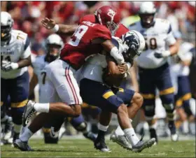  ?? ASSOCIATED PRESS FILE ?? Alabama defensive back Minkah Fitzpatric­k sacks Kent State quarterbac­k Mylik Mitchell during the 2016 season. Fitzpatric­k could help the Browns fill an immediate need via the draft.