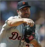  ?? DAVID ZALUBOWSKI — THE ASSOCIATED PRESS ?? Detroit Tigers starting pitcher Justin Verlander makes a pickoff throw to first base to keep Colorado Rockies’ Charlie Blackmon close to the bag in the third inning of a baseball game Wednesday in Denver. The Tigers won 6- 2.