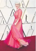  ?? FRAZER HARRISON GETTY IMAGES ?? Floaty and fuchsia? Helen Mirren made the unexpected combo work in custom Schiaparel­li haute couture paired with Harry Winston jewelry.