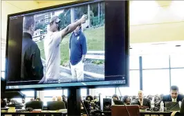  ?? LANNIS WATERS / THE PALM BEACH POST / POOL ?? Nouman Raja, in a “walk through” video shown at a court hearing Monday, shows how he took aim before fifiring on Corey Jones. “I didn’t want to die,” Raja told investigat­ors in the video, describing his feelings as he fifired two sets of three shots,...