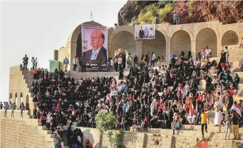  ?? AFP ?? Yemenis celebrate the 56th anniversar­y of the September 26 revolution in the citadel of Cairo Castle, in the southern city of Taiz yesterday. A picture of Yemeni President Abd Rabbo Mansour Hadi is visible in the background.