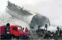  ?? Igor Kovleenko / EPA ?? Rescuers work near a huge section of the crashed Turkish plane at Dacha-Suu village in Kyrgyzstan yesterday.
