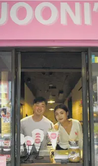  ?? PHOTO: GREGOR RICHARDSON ?? Crepe expectatio­ns . . . Nikko Kim and Joo Kim at their Jooni’s Crepes window in George St yesterday.