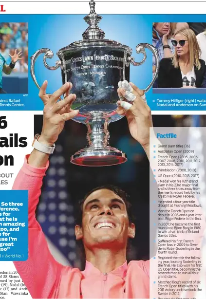  ?? AP ?? » World No. 1 Rafael Nadal holds up the championsh­ip trophy after beating Kevin Anderson in the men’s singles final of the US Open on Sunday. The Spaniard won 6-3, 6-3, 6-4.