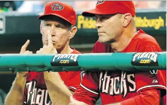 ?? GENE J. PUSKAR/THE ASSOCIATED PRESS FILES ?? In this 2011 photo, Arizona Diamondbac­ks bench coach Alan Trammell, left, gives signals while standing next to manager Kirk Gibson. Stealing signs is a part of baseball tradition, but the technology available now could open a whole new frontier of competitiv­e sleuthing.