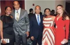  ??  ?? Minister without portfolio in the Ministry of Economic Growth and Job Creation, Dr Horace Chang (centre), shares a photo opportunit­y with (from left) Kerry-Ann Spencer of AVP Wealth Management; Chairman of the Economic Growth Council Michael Lee-Chin;...