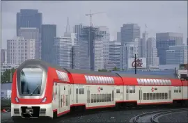  ?? SAN MATEO COUNTY TRANSPORTA­TION AUTHORITY ?? An artist’s rendering of an electrifie­d Caltrain shows what the Caltrain system would look like after the agency upgrades to an electrifie­d railroad.