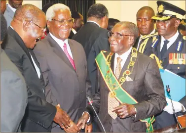  ?? —(Picture by Tawanda Mudimu) ?? President Mugabe is welcomed by Macroecono­mic Planning and Investment Promotion Minister Dr Obert Mpofu, while Home Affairs Minister Dr Ignatius Chombo looks on at the official opening of the Fifth Session of the Eighth Parliament of Zimbabwe in Harare...