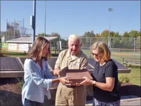  ?? BOB KEELER — MEDIANEWS GROUP ?? The new brick honoring Pat McNulty for his military service is held by McNulty, center, and West Rockhill Park & Recreation Committee members Maggie Oliver, left, and Suzanne Clarke.