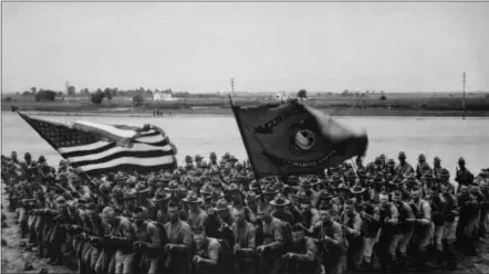  ?? PHOTO COURTESY OF NATIONAL ARCHIVES ?? “First to Fight.” A group of U.S. Marines. U.S. Marine Corps Recruiting Publicity Bureau (1918).