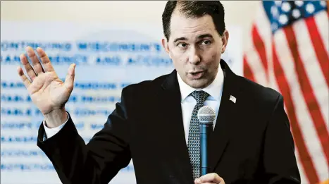  ?? JIM MATTHEWS/AP ?? Wisconsin Gov. Scott Walker defends the measures he signed as improving transparen­cy, stability and accountabi­lity.