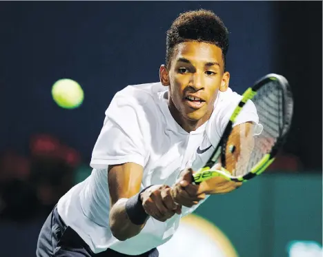  ?? MARK BLINCH/THE CANADIAN PRESS ?? Canadian teenager Felix Auger-Aliassime lost a marathon match to Daniil Medvedev of Russia on Wednesday night at the Rogers Cup in Toronto, with Medvedev winning in a third-set tiebreaker, 3-6, 6-4, 7-6 (7), to eliminate the Canadian on his 18th birthday.