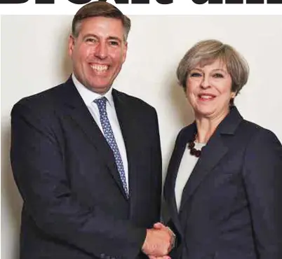  ??  ?? Strong support: Backbench Tory MP Graham Brady, pictured with Mrs May, is knighted