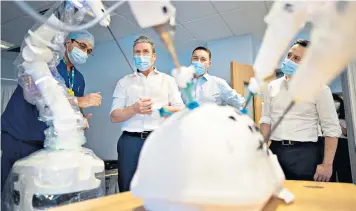  ?? ?? Keir Starmer, centre left, and Wes Streeting, Labour health spokesman, centre right, at the Lister Hospital in Stevenage yesterday