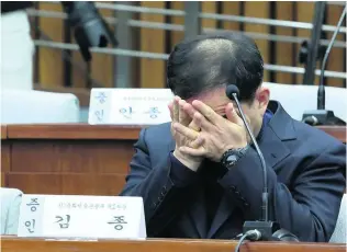  ?? Ahn Young-joon / Reuters ?? Kim Chong, South Korea’s former vice sports minister, listens during a parliament­ary hearing on the corruption scandal engulfing president Park Geun-hye, in Seoul yesterday.