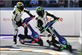  ?? VALERIO PENNICINO — GETTY IMAGES ?? Irish rider Nicci Daly, right, competes at the eSC eSkootr Championsh­ip in Sion, Switzerlan­d, in May 2022. Emeryville has agreed to host the internatio­nal eSkootr Championsh­ip Racing Series later this year.