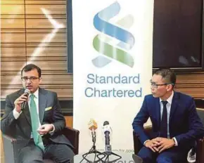  ?? PIC BY NIK HARIFF HASSAN ?? Standard Chartered head investment strategist Manpreet Gill (left) and head of managed investment and product management Danny Chang at the Standard Chartered H2 Global Market Outlook in Kuala Lumpur yesterday.
