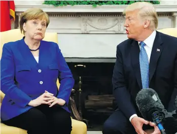  ?? THE ASSOCIATED PRESS ?? President Donald Trump meets with German Chancellor Angela Merkel in the Oval Office as they discuss a waiver of U.S. tariffs on German steel and aluminum exports Friday.