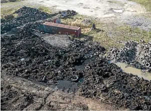  ?? CHRIS SKELTON/STUFF ?? A site of disused tyres in a commercial yard in Rolleston that went up in flames.