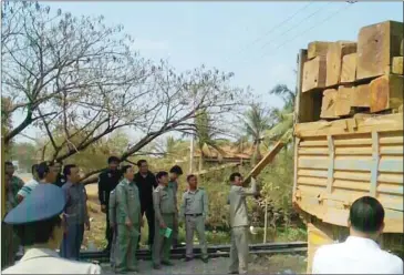  ?? SUPPLIED ?? Authoritie­s seize illegal timber that allegedly belonged to a deputy military police chief, on Saturday in Kampong Speu province.