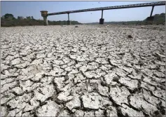  ??  ?? File photo of a water pump shed in the dried-up portion of the Sabarmati river on a hot day on the outskirts of Ahmedabad, India. — Reuters photo