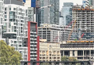  ?? ANDREW FRANCIS WALLACE TORONTO STAR ?? Cranes swarm downtown Toronto on Wednesday. The mass building of low-cost rental housing — on a scale seen in some European cities — is key to economic health going forward, York University economist James McKellar says.