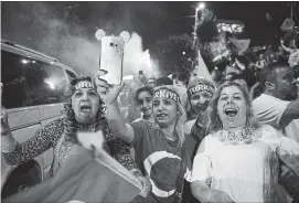  ?? JEFF J MITCHELL
GETTY IMAGES ?? Recep Tayyip Erdogan’s supporters celebrate outside the AK party headquarte­rs on Sunday in Istanbul, Turkey. Erdogan claimed victory in the election, but the opposition had not yet conceded.