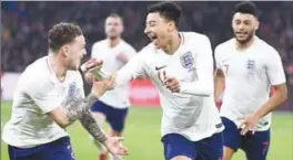  ??  ?? England’s Jesse Lingard (right) celebrates with teammate Kieran Trippier after scoring against the Netherland­s during Friday’s friendly match in Amsterdam. – AFPPIX
looks as though Cardiff City can finally move on from the controvers­y surroundin­g...