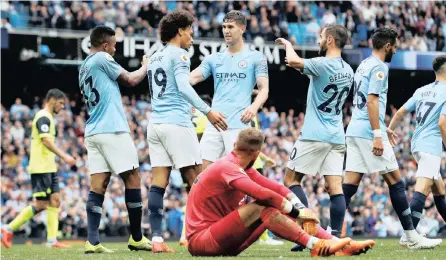  ?? PICTURE: REUTERS ?? CRUISE CONTROL: Manchester City’s Leroy Sane celebrates scoring the sixth goal in a 6-1 rout of Huddersfie­ld yesterday as the defending champions showed their class and ruthlessne­ss in front of goal in a dominant display.