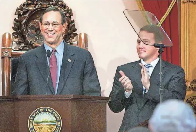  ?? ?? TOP: In 2006, then Ohio House Speaker Jon Husted, right, helped override a veto by former Gov. Bob Taft.
FRED