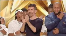  ?? ?? SIDUMO Nyamezele, right, and Mzansi Youth Choir members with Simon Cowell, one of the ‘America’s Got Talent’ judges.