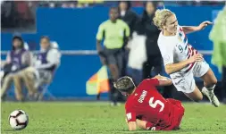  ?? OMAR VEGA GETTY IMAGES ?? Canadian Rebecca Quinn cuts down American Lindsey Horan in Wednesday night’s tense CONCACAF final at Toyota Stadium in Frisco, Texas.