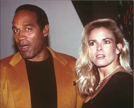  ?? PAUL HURSCHMANN, FILE — THE ASSOCIATED PRESS ?? O.J. Simpson and his ex-wife, Nicole Brown Simpson, arrive for the opening of the Harley-Davidson Cafe in New York on Oct. 19, 1993. Simpson, the decorated football superstar and Hollywood actor who was acquitted of charges he killed Nicole Brown Simpson and her friend but later found liable in a separate civil trial, has died. He was 76.