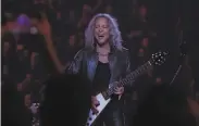  ?? Nick Otto / Special to The Chronicle 2019 ?? Guitarist Kirk Hammett takes part in Metallica’s performanc­e with the S.F. Symphony in 2019.