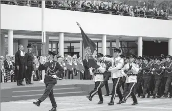  ?? ANDY CHONG / CHINA DAILY ?? Andrew Cheung Kui-nung (left), chief justice of the Court of Final Appeal, inspects a Ceremonial Guard mounted by the Hong Kong Police Force at Edinburgh Place during the Ceremonial Opening of Legal Year 2024.