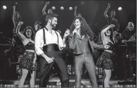  ??  ?? Mauricio Martinez plays Emilio Estefan with Christie Prades as Gloria Estefan in On Your Feet!, onstage this week at Fayettevil­le’s Walton Arts Center.