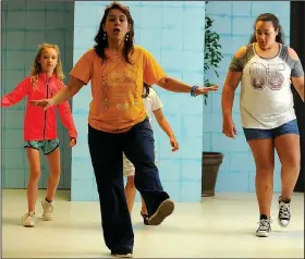  ?? File photo/ANDY SHUPE ?? Jules Taylor works with actors Viola Kelley (from left), Violet Newberry and Kayla Henderson during the “Broadway Bound” theater camp at Arts Live Theatre in Fayettevil­le. The “Arts Live Gala” benefit will be Feb. 10 at the Fayettevil­le Town Center.