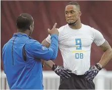  ?? STAFF PHOTOS BY NANCY LANE ?? JOB INTERVIEWS: John Johnson gets some instructio­n during yesterday’s Boston College pro day; at right, linebacker Matt Milano runs through a drill.