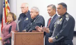  ?? ADOLPHE PIERRE-LOUIS/JOURNAL ?? FBI Special Agent Terry Wade, second from right, addresses the media at a news conference the day after the Dec. 7 shooting at Aztec High School, which left two students dead. The shooter, William Atchison, 21, committed suicide.