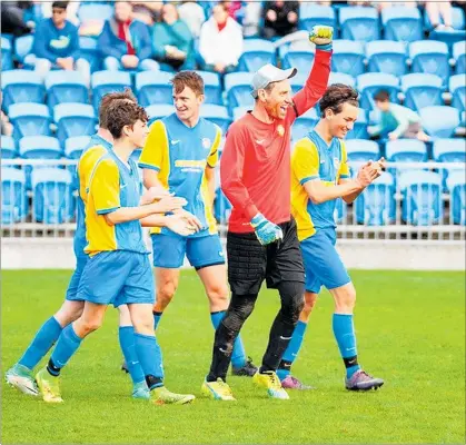  ?? PICTURE / WARD JAMESON ?? Keri Siteworx goalie Simon Hart, flanked by sons Oscar and Max, celebrates winning the Stafford Choat Plate final following the 5-nil win over Central Brown at Toll Stadium on Saturday.