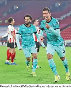  ?? – AFP photo ?? Liverpool’s Brazilian midfielder Roberto Firmino celebrates scoring his team’s second goal during the English Premier League football match between Sheffield United and Liverpool at Bramall Lane in Sheffield, northern England.