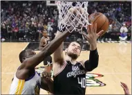  ?? MARK J. TERRILL — THE ASSOCIATED PRESS ?? Warriors forward Draymond Green, left, and Clippers center Ivica Zubac go after a rebound during the first half Tuesday in Los Angeles.