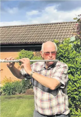  ??  ?? Flautist
John Boyd is raising funds for Auchterard­er’s Covid-19 Support Group