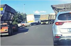  ?? ?? Congestion on the John Ross highway continues unabated as trucks queue to gain access to the port